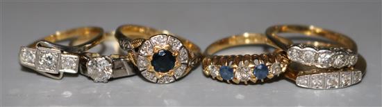 Six assorted early 20th century and later 18ct gold and gem set dress rings, various sizes.
